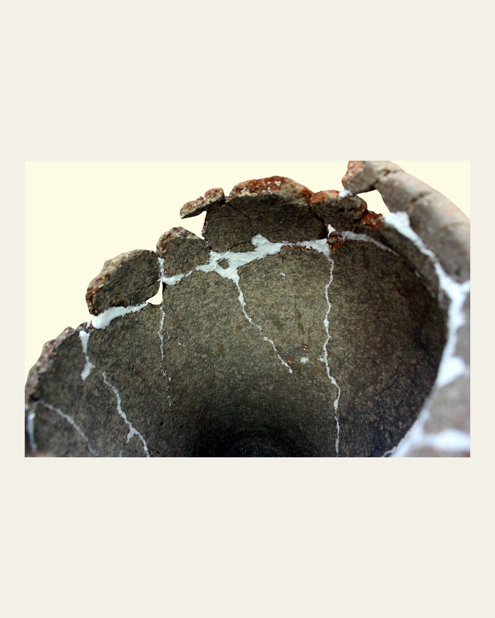 Detail of the stabilised vessel rim showing visible fills.