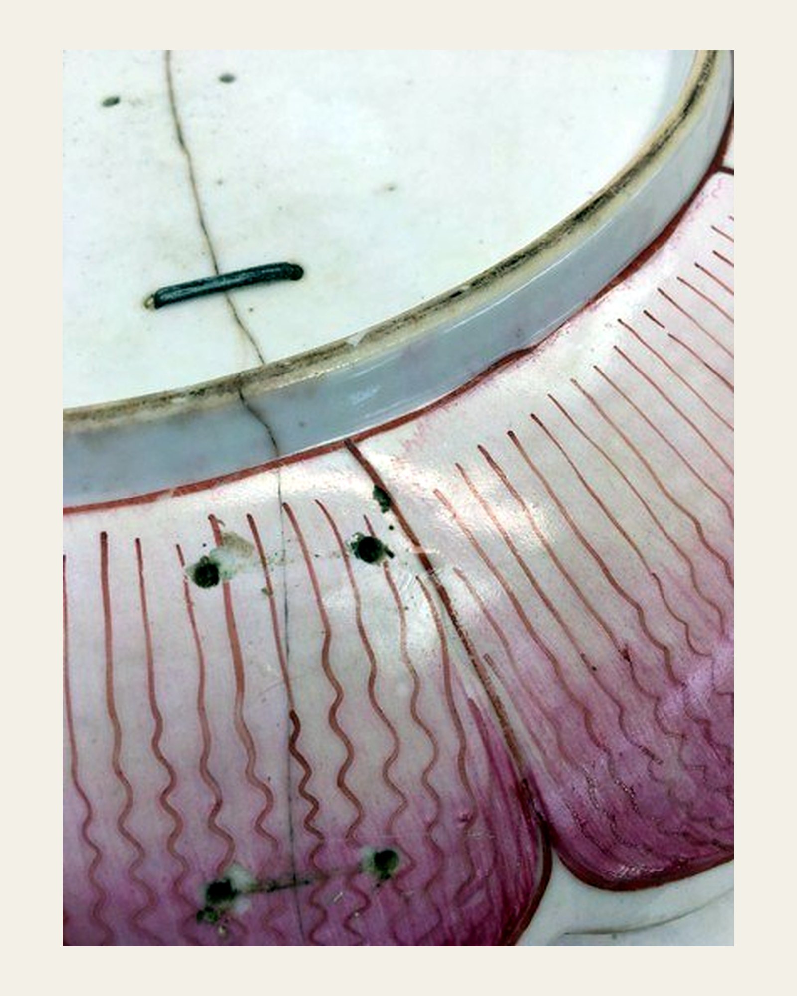 Earlier riveted repair on the dish before dismantling.