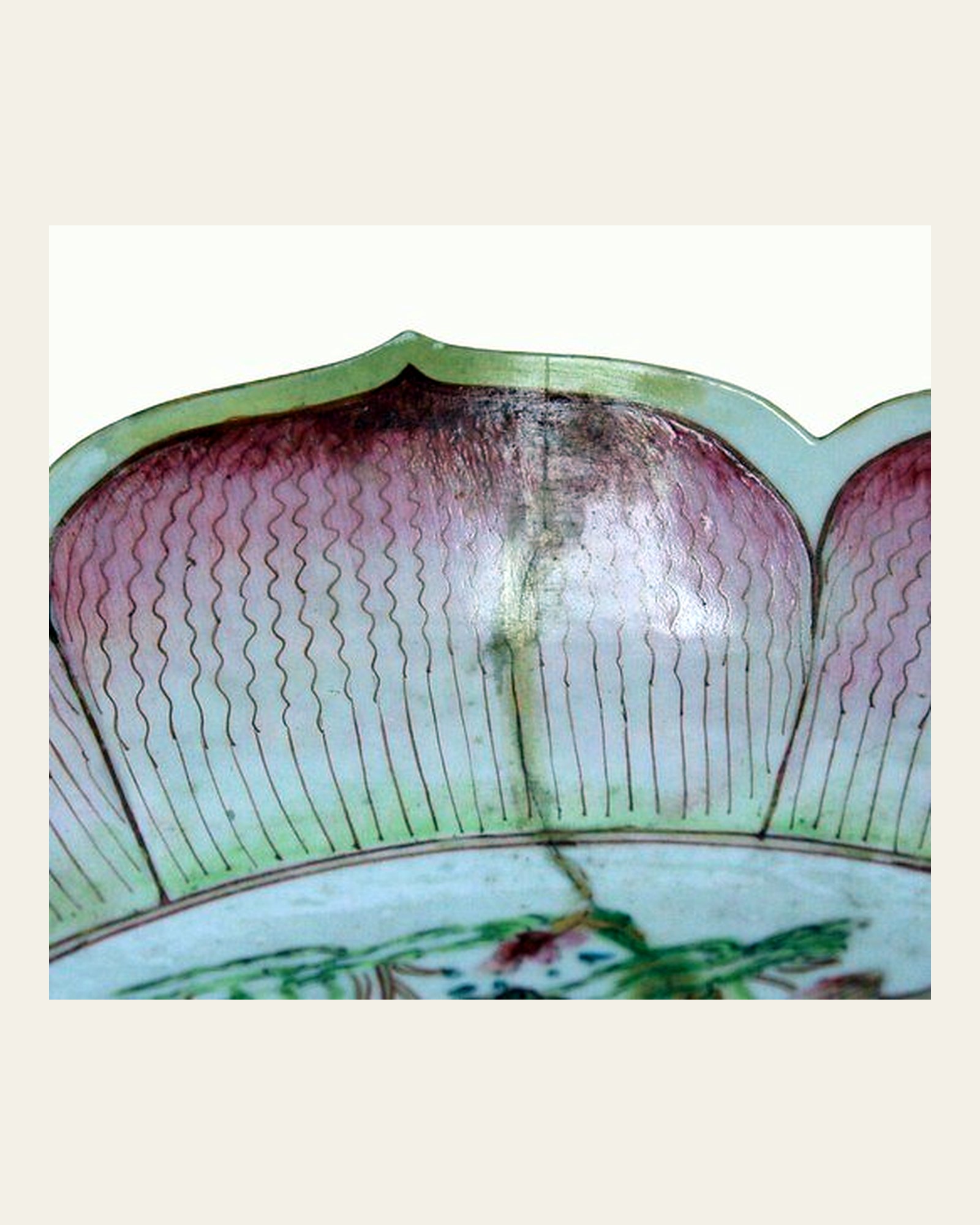 Stained join on the famille rose dish before cleaning.