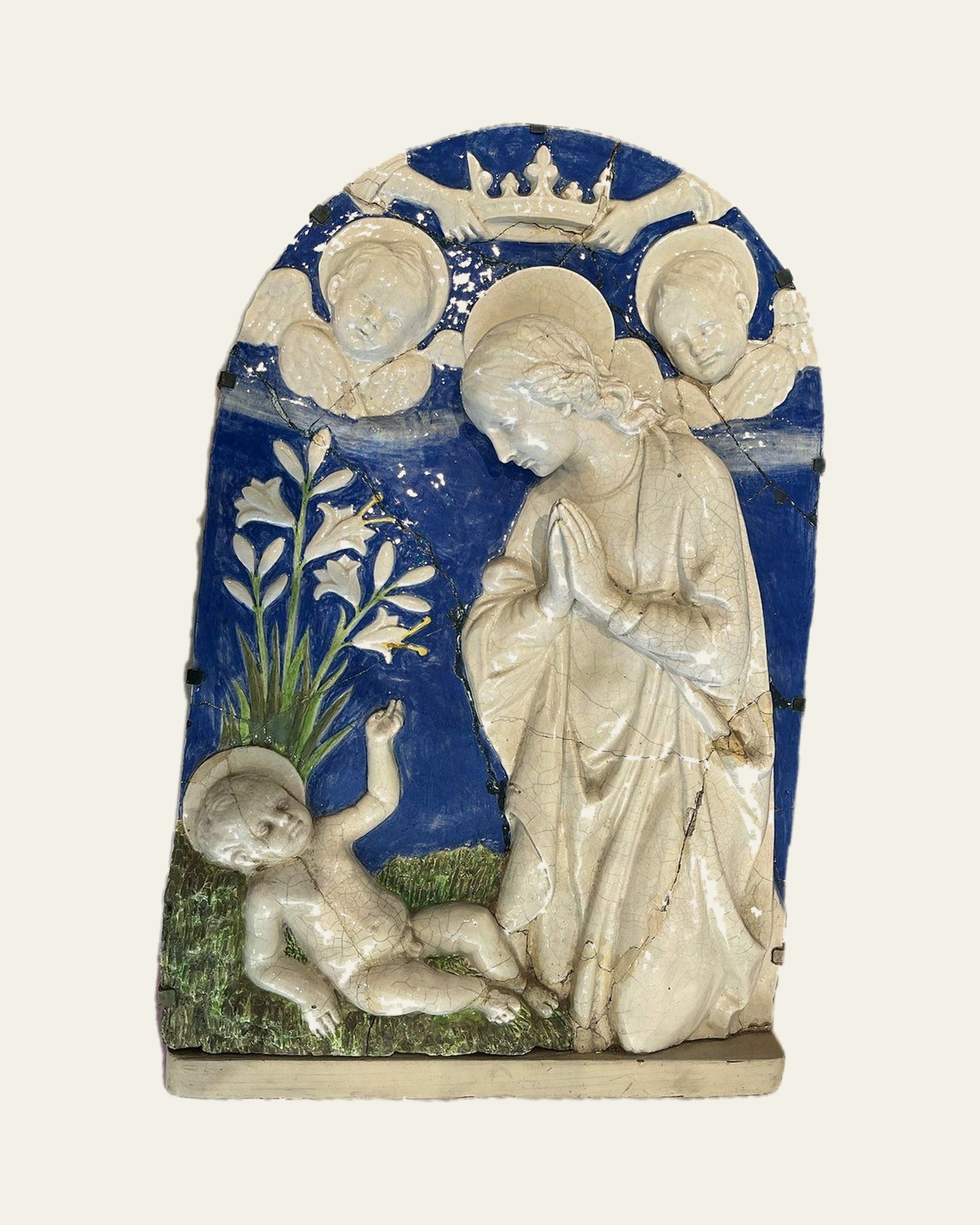 Della Robbia-style tin-glazed earthenware plaque before conservation, with misaligned joins and lifting fills.