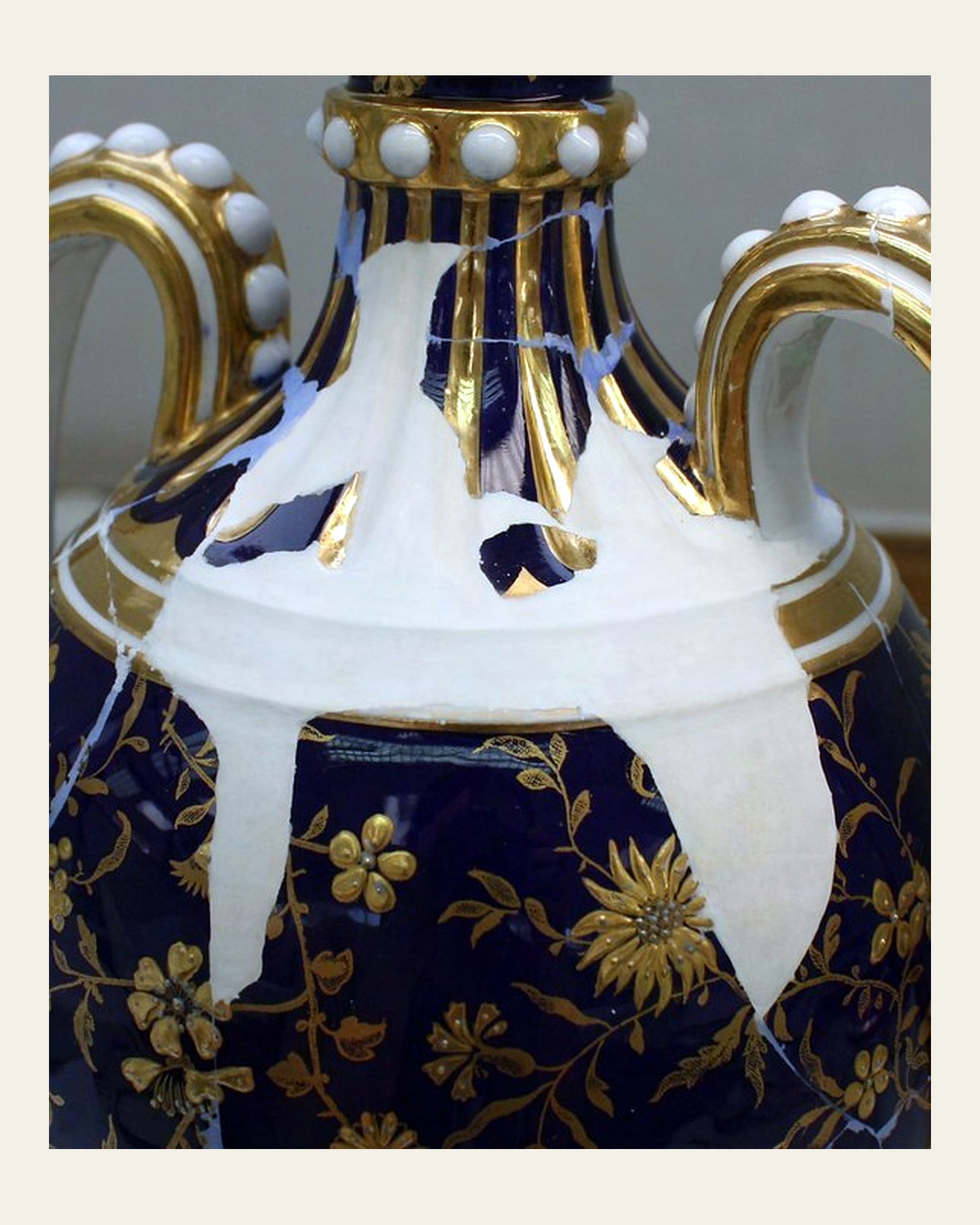 Reconstructed losses at the urn shoulder and neck before retouching.